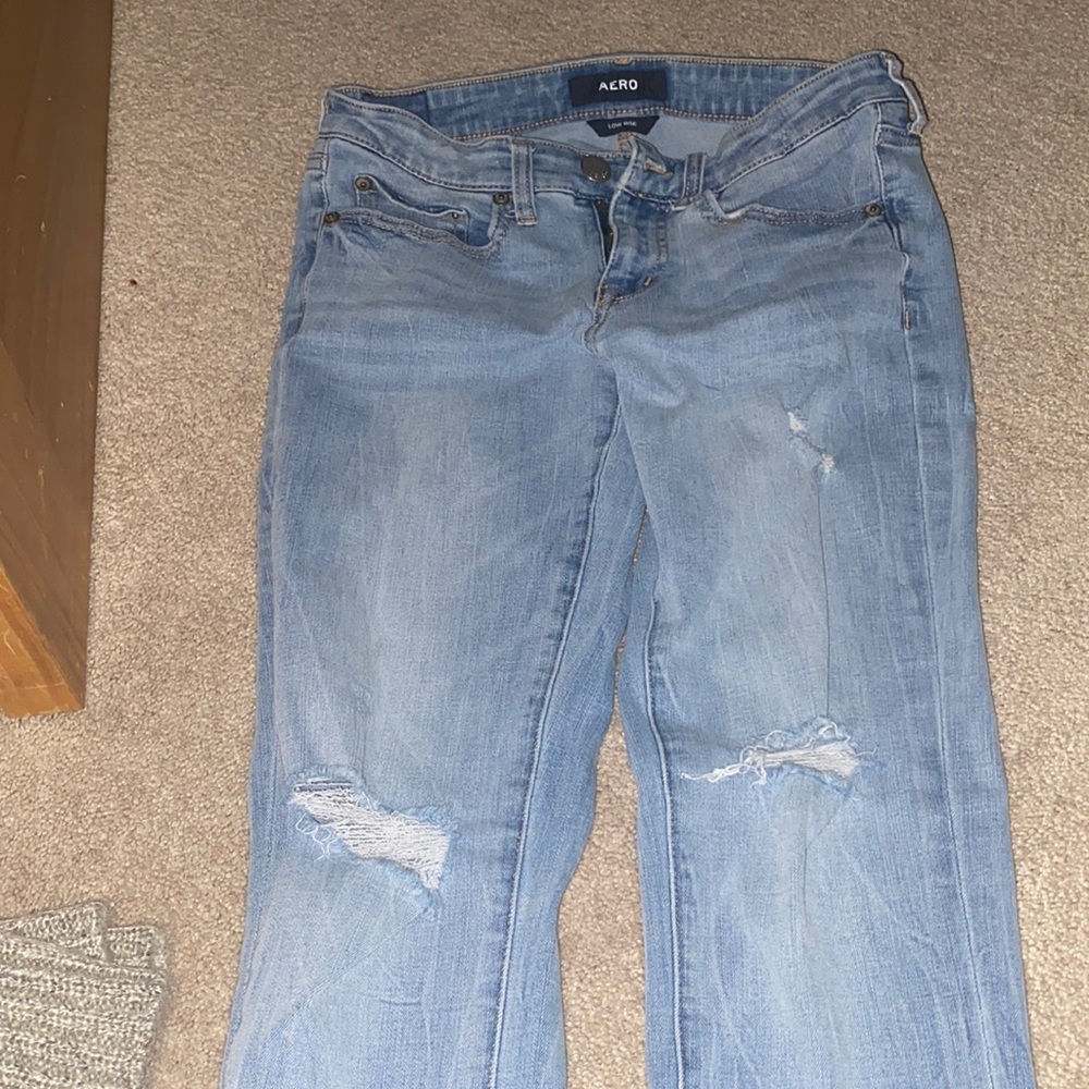 Low rise blue denim ripped jeans